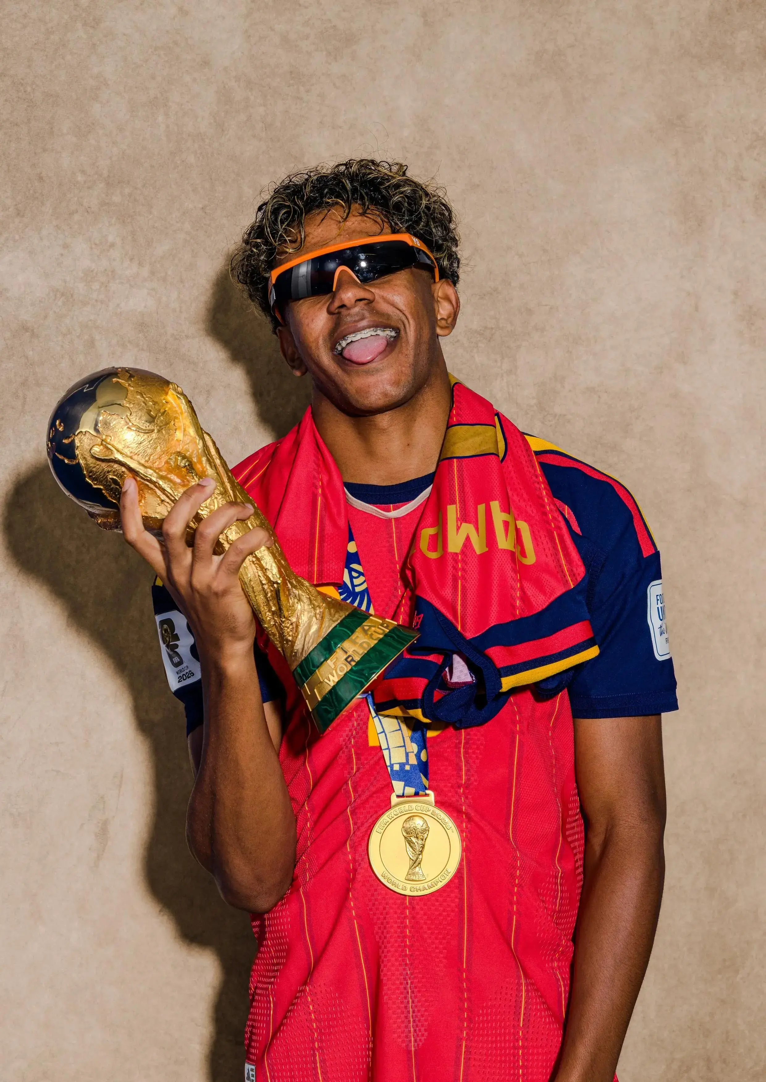EAST RUTHERFORD, NEW JERSEY - JULY 19: (EXCLUSIVE COVERAGE; EDITOR'S NOTE: This image has been digitally altered.) Lamine Yamal #19 of Spain poses for a portrait with the FIFA World Cup Winner's Trophy after the FIFA World Cup 2026 Final match between Spain and Argentina at New York New Jersey Stadium on July 19, 2026 in East Rutherford, New Jersey. (Photo by Ryan Pierse - FIFA/FIFA via Getty Images)